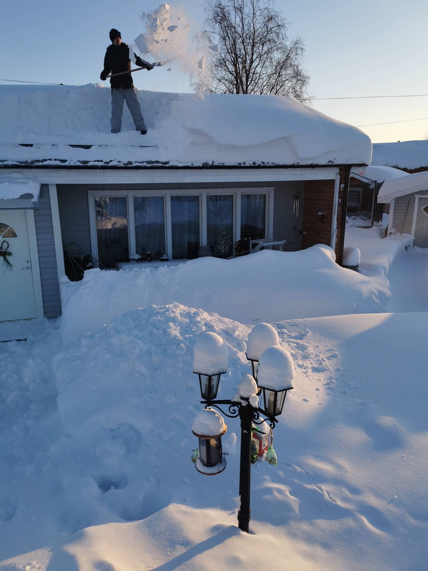 Clearing snow off your roof can help prevent ice dams from forming.